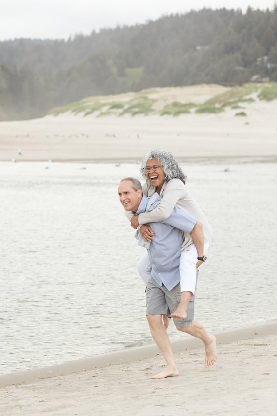 Cute Older Couple Walk on the Beach